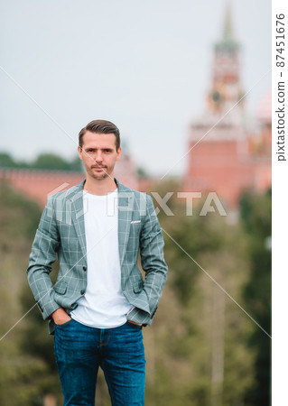 Happy young urban man in european city. Happy young urban man in european city. 87451676