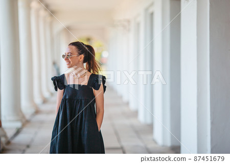 Woman in black outdoor in summer Woman in black outdoor in summer 87451679