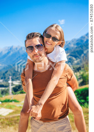 Beautiful happy family in mountains in the background of fog 87451680