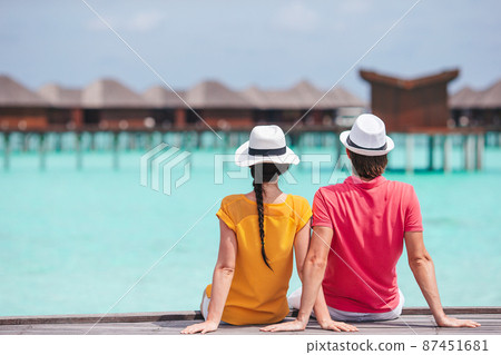 Young couple on white beach during summer vacation. Young couple on white beach during summer vacation. 87451681
