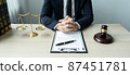 Counselor lawyer or notary working on a documents and report of the important case and wooden gavel, brass scale on table in courtroom 87451781