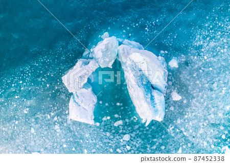 Iceland. An aerial view of an iceberg. Winter landscape from a drone. Iceberg Lagoon. Iceland. An aerial view of an iceberg. Winter landscape from a drone. Iceberg Lagoon. 87452338
