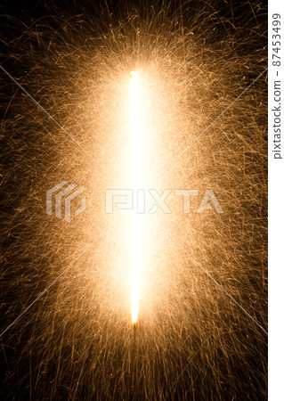 fire sparks particles on black background for overlay design, shot taken with slow shutter, long traces, large sheaf of sparks, emission source on the top left corner fire sparks particles on black background for overlay design, shot taken with slow shutter, long traces, large sheaf of sparks, emission source on the top left corner 87453499
