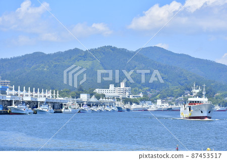 Fishing boat departing from the fishing port 87453517