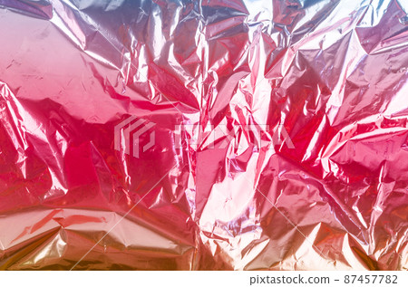 Colourful foil background with shiny crumpled surface for background. 87457782