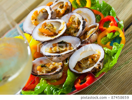 Baked in oven bivalve shellfishes Baked in oven bivalve shellfishes 87458659