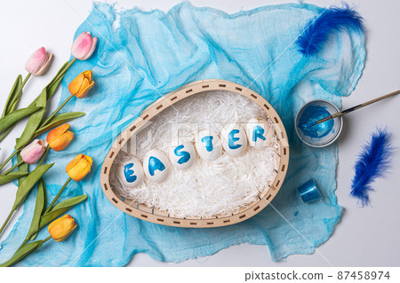 Happy easter time. Bright Easter holiday concept with spring flowers and easter eggs. Colorful Easter eggs background 87458974