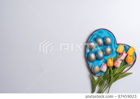 Happy easter time. Bright Easter holiday concept with spring flowers and easter eggs. Colorful Easter eggs background Happy easter time. Bright Easter holiday concept with spring flowers and easter eggs. Colorful Easter eggs background 87459023