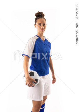 Portrait of confident biracial young female player with ball standing against white background 87459329