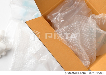 Cushioning material and cardboard box | White background 87459580