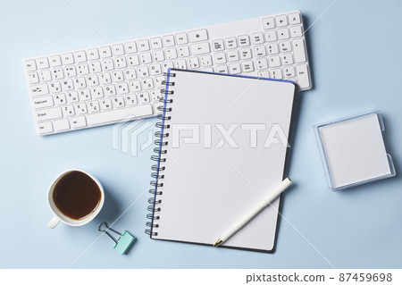 Bright office workspace. Work space with notepad, keyboard, coffee and glasses. Work space table desk. Flat lay, top view, copy space Bright office workspace. Work space with notepad, keyboard, coffee and glasses. Work space table desk. Flat lay, top view, copy space 87459698