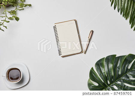 Bright office workspace. Work space with notepad, keyboard, coffee and glasses. Work space table desk. Flat lay, top view, copy space Bright office workspace. Work space with notepad, keyboard, coffee and glasses. Work space table desk. Flat lay, top view, copy space 87459701