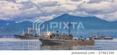 Warships in the maritime parade on bay on Pacific ocean in Kamchatka Peninsula 87462390
