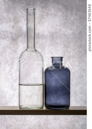 Still life with glass dishes on a wooden shelf Still life with glass dishes on a wooden shelf 87463648