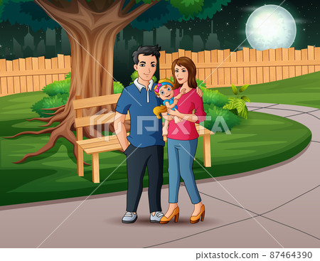 Happy family walks in park at night 87464390