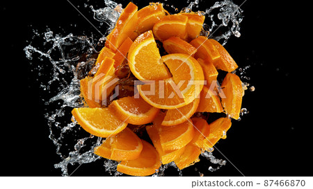 Freeze motion of sliced oranges in water splash. Freeze motion of sliced oranges in water splash. 87466870