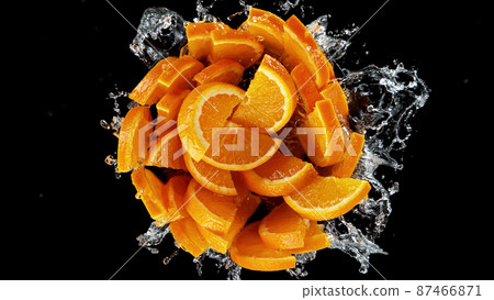 Freeze motion of sliced oranges in water splash. Freeze motion of sliced oranges in water splash. 87466871