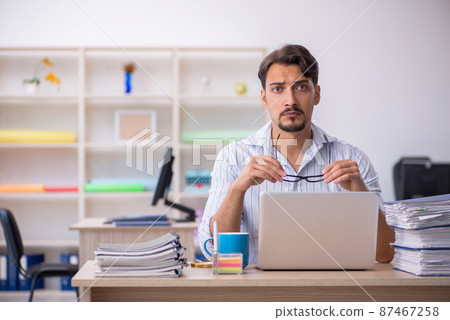 Young male employee working in the office 87467258