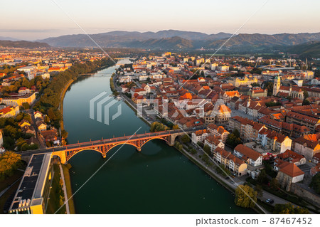 City of Maribor in Slovenia illuminated by rising sun in the summer morning City of Maribor in Slovenia illuminated by rising sun in the summer morning 87467452