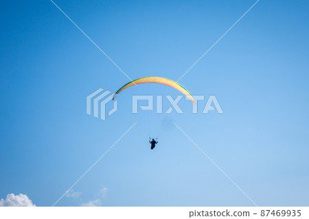 paragliding flight in the mountains. Le Grand-Bornand, France 87469935