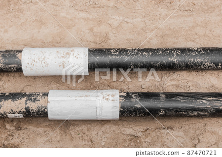 Repair of the water line of the heating main pipe in the ground trench pipeline at the construction site work industry Repair of the water line of the heating main pipe in the ground trench pipeline at the construction site work industry 87470721