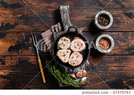 Fresh Raw beef Marrow bones in pan for cooking broth. Wooden background. Top view 87470763
