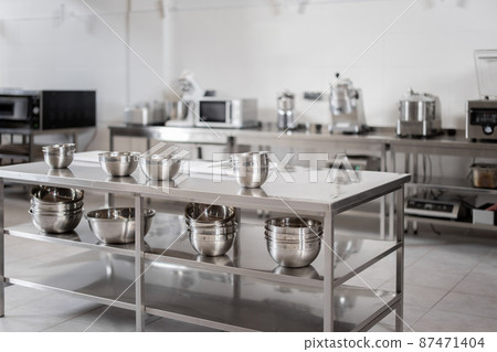 Professional restaurant kitchen with kitchen equipment 87471404