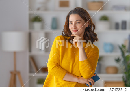 woman standing in the living room 87472242