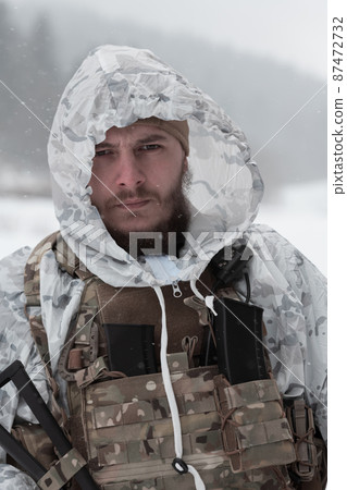 Soldier in winter camouflaged uniform in Modern warfare army on a snow day on forest battlefield with a rifle. Model face very similar to Ukraine prime minister. Soldier in winter camouflaged uniform in Modern warfare army on a snow day on forest battlefield with a rifle. Model face very similar to Ukraine prime minister. 87472732