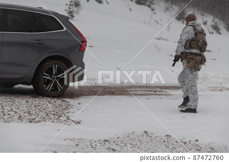 Soldier in winter camouflaged uniform in Modern warfare army on a snow day on forest battlefield with a rifle. Model face very similar to Ukraine prime minister. Soldier in winter camouflaged uniform in Modern warfare army on a snow day on forest battlefield with a rifle. Model face very similar to Ukraine prime minister. 87472760