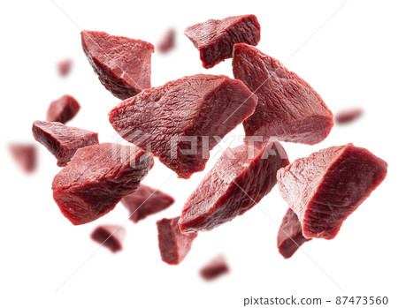 Pieces of fresh meat levitate on a white background Pieces of fresh meat levitate on a white background 87473560