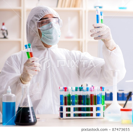 The young handsome chemist working in the lab The young handsome chemist working in the lab 87473655