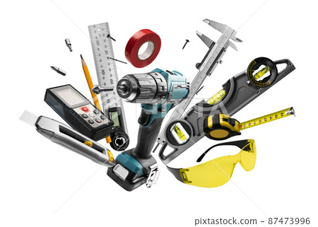 Construction tools levitate on a white background 87473996