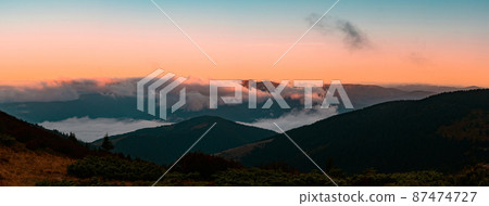 Petros Mountain in the morning fog, overcast mountain range at dawn, the magical mountains of Ukraine. Petros Mountain in the morning fog, overcast mountain range at dawn, the magical mountains of Ukraine. 87474727