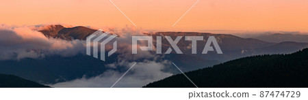 Petros Mountain in the morning fog, overcast mountain range at dawn, the magical mountains of Ukraine. Petros Mountain in the morning fog, overcast mountain range at dawn, the magical mountains of Ukraine. 87474729