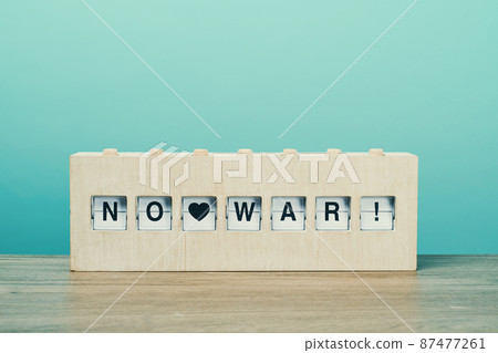 text no war in a wooden split flap board text no war in a wooden split flap board 87477261