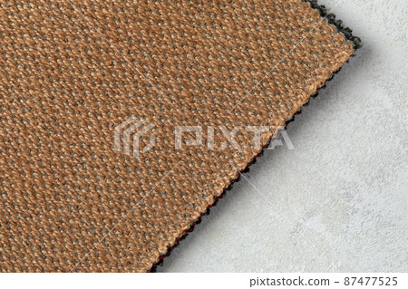 abstract texture of rough cotton fabric or canvas with drawing from fibers a cross crosswise for backgrounds of beige color abstract texture of rough cotton fabric or canvas with drawing from fibers a cross crosswise for backgrounds of beige color 87477525