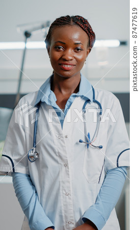 Portrait of medical specialist with white coat and stethoscope Portrait of medical specialist with white coat and stethoscope 87477619