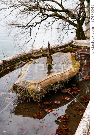 Old fountain near Lake Como in the garden. Villa Monastero, Italy 87479543