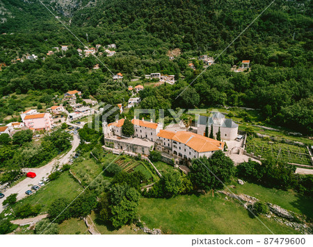 Podmaine monastery surrounded by green trees. Top view Podmaine monastery surrounded by green trees. Top view 87479600