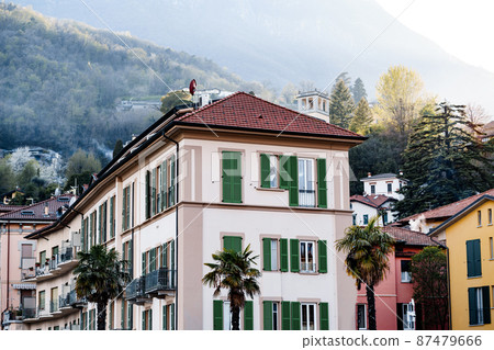 Old house surrounded by palm trees in Menaggio. Lake Como, Italy Old house surrounded by palm trees in Menaggio. Lake Como, Italy 87479666