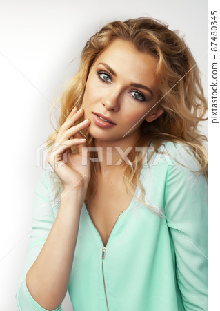 young pretty stylish blond girl posing emotional isolated on white background happy smiling cool smile, lifestyle people concept young pretty stylish blond girl posing emotional isolated on white background happy smiling cool smile, lifestyle people concept 87480345