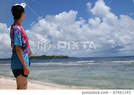 Guam A man looking at the tropical sea Guam A man looking at the tropical sea 87481145