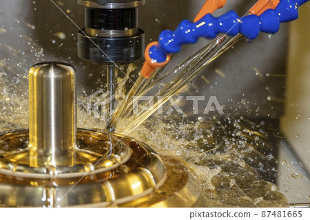 Close-up scene the CNC milling machine cutting the shell mold parts with oil coolant method. 87481665