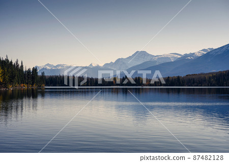 Canadian rockies with autumn forest and clear sky on Pyramid lake in Jasper national park Canadian rockies with autumn forest and clear sky on Pyramid lake in Jasper national park 87482128