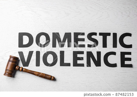 Words DOMESTIC VIOLENCE and gavel on white wooden table, flat lay Words DOMESTIC VIOLENCE and gavel on white wooden table, flat lay 87482153