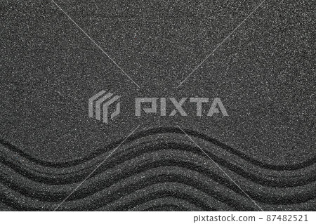 Top view of beautiful black sand. Zen and harmony Top view of beautiful black sand. Zen and harmony 87482521