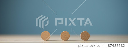 Three blank wooden cut circles placed in a row Three blank wooden cut circles placed in a row 87482682