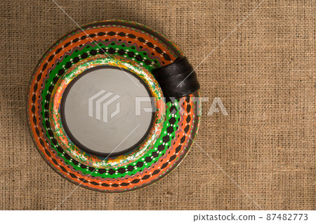 Top view of a colorful Egyptian handcrafted artistic pottery jar Top view of a colorful Egyptian handcrafted artistic pottery jar 87482773