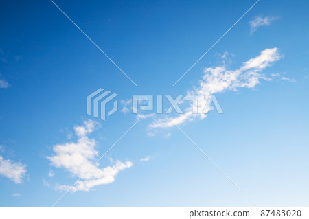 Blue sky with small white clouds on a daytime. Natural photo 87483020
